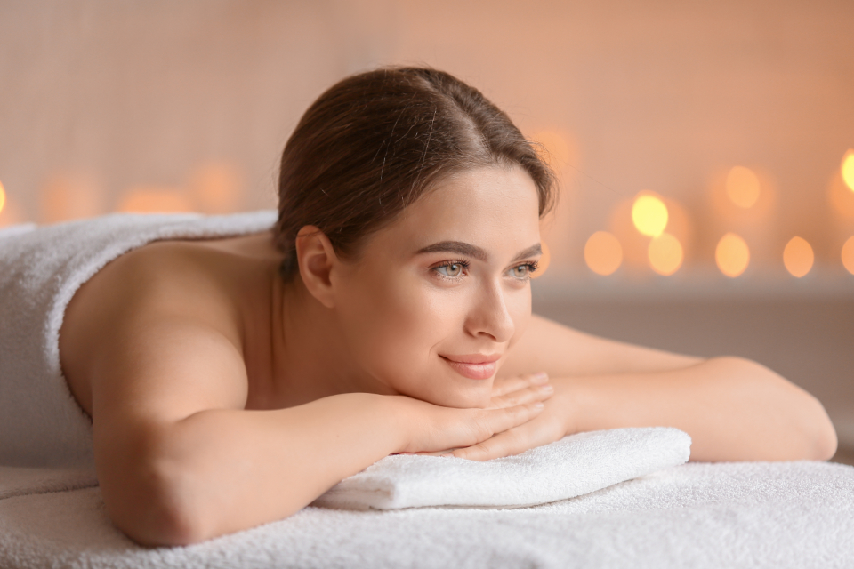 Guest relaxing in a calm, warm spa suite