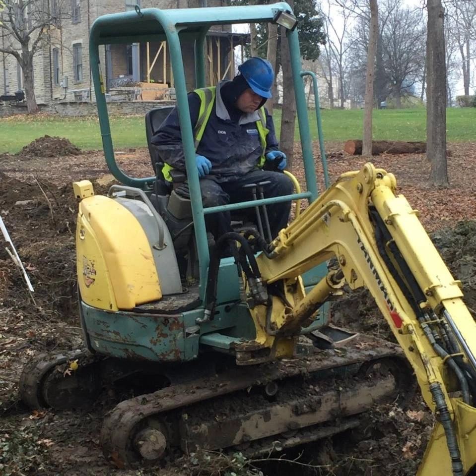 Drain Patrol mini excavator on a job site