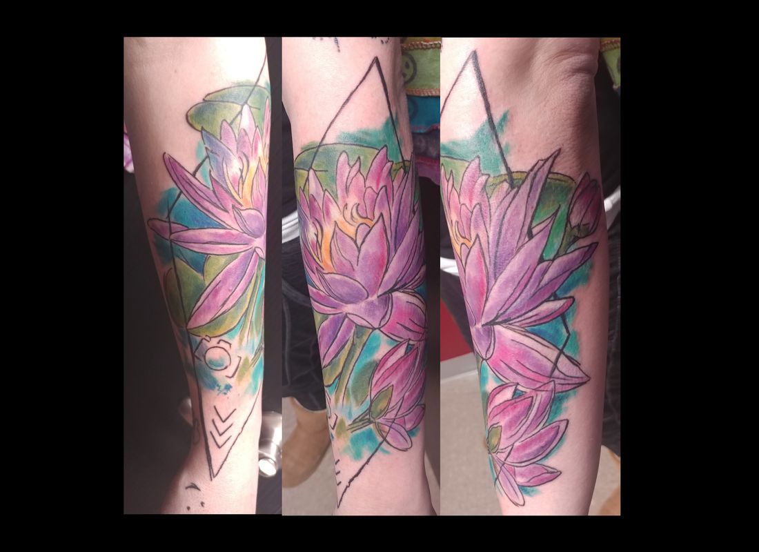 Color lotus forearm tattoo