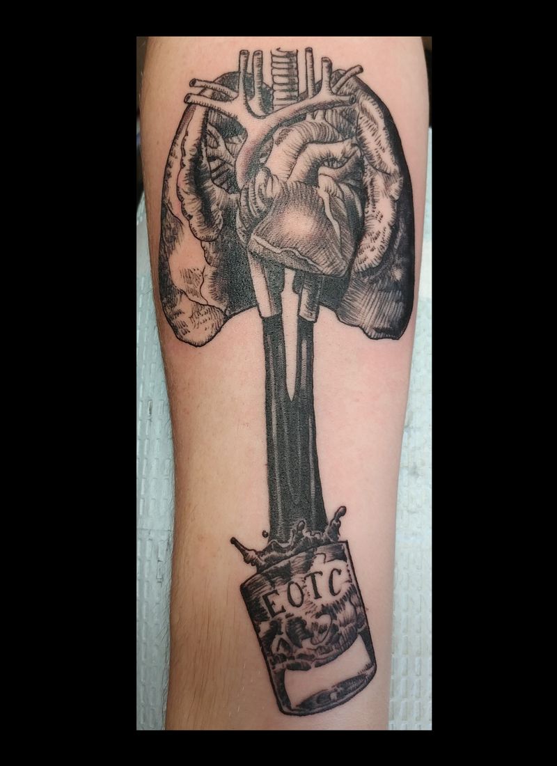 Anatomical heart and oil can tattoo