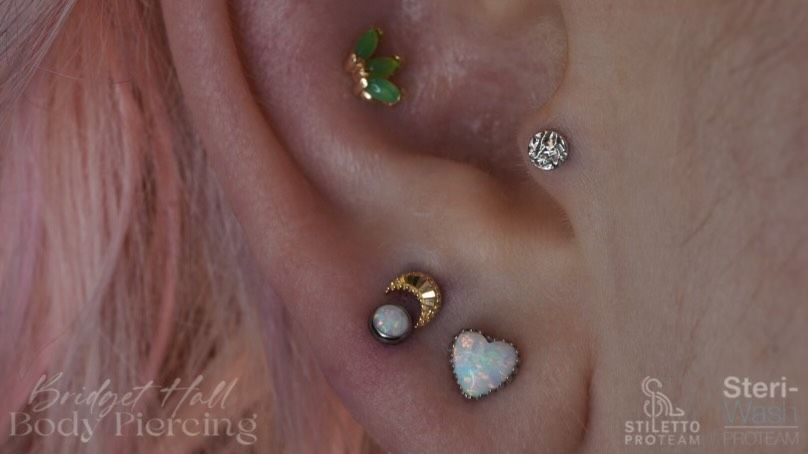 Heart stud ear piercings