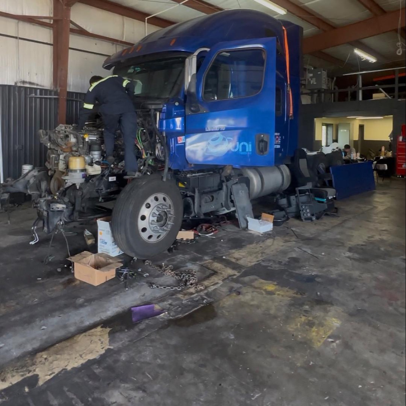 Cab-off engine replacement in progress