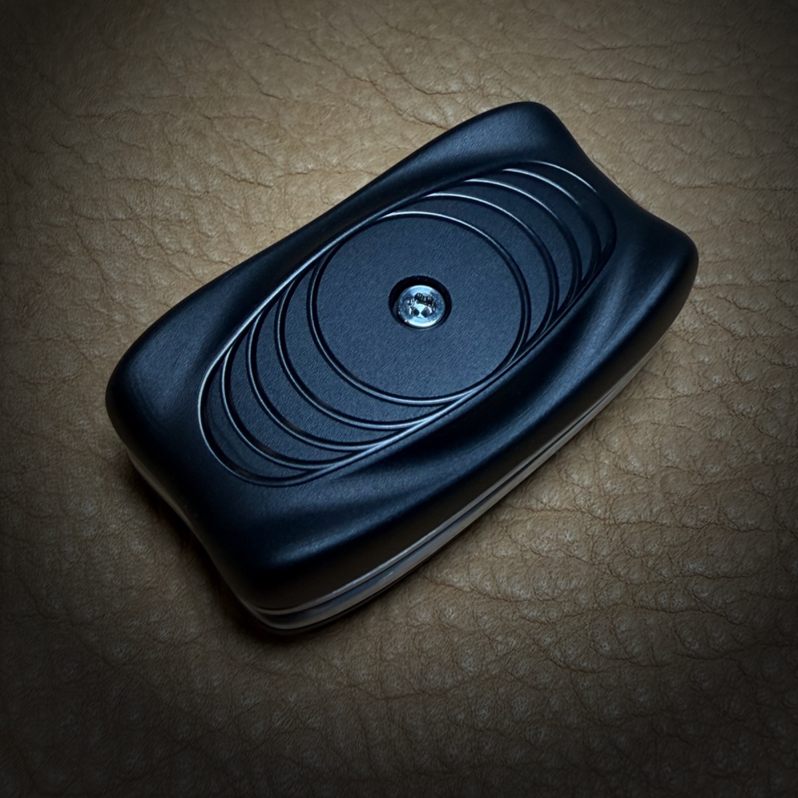 Echelon Slider BlackOps — CNC-machined fidget slider on leather