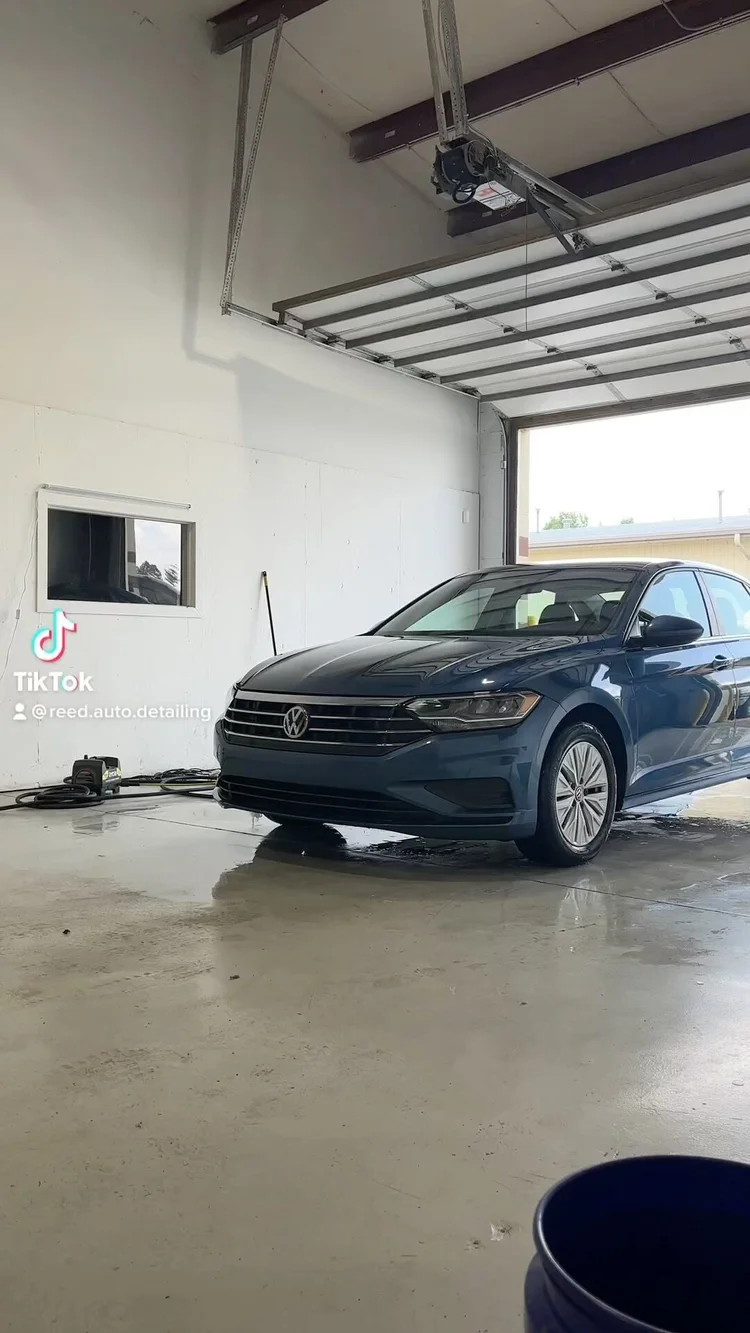 Volkswagen Jetta after a wash in the shop bay